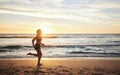 Woman, fitness and running on the beach sunset for healthy cardio exercise, training or workout in the outdoors. Female Royalty Free Stock Photo