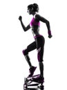 Woman fitness stepper exercises silhouette