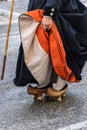 A woman fits motheries, rustic wooden shoes that were used in Cantabria Spain Royalty Free Stock Photo