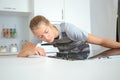 Woman fitting new electrical hob Royalty Free Stock Photo