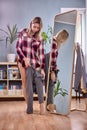 Woman is fitting pants in front of full length mirror