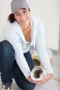 woman fitting roll underlay to floor Royalty Free Stock Photo