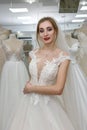 Woman fitting wedding dress and veil in shop Royalty Free Stock Photo
