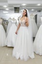 Woman fitting wedding dress and veil in shop Royalty Free Stock Photo