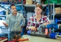 Woman fixing and assembling plumbing fixture in workshop Royalty Free Stock Photo