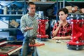 Woman fixing and assembling plumbing fixture in workshop Royalty Free Stock Photo