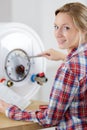 woman fixing electric boiler Royalty Free Stock Photo