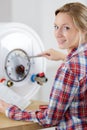 woman fixing electric boiler