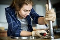 Woman fixing the kitchen sink