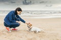 Woman flatters dog.