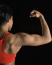 Woman flexing bicep.