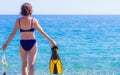 Woman with flippers snorkeling tube on beach Royalty Free Stock Photo