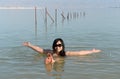 Woman floating in the Dead Sea