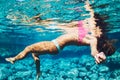 Woman floating in Natural Pool