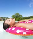 Woman Floating in Pool With Eyes Closed Royalty Free Stock Photo