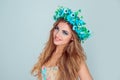 Woman with floral crown on head smiling looking at camera Royalty Free Stock Photo