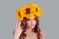 Woman with floral headband is showing peace sign Royalty Free Stock Photo