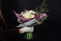 Woman holding flower bouquet