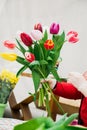 Woman florist makes bouquet of fresh tulips. Hands hold spring flowers. Royalty Free Stock Photo