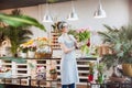 Woman florist standing and holding bunch of pink tulips Royalty Free Stock Photo