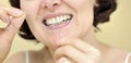 Woman flossing her teeth Royalty Free Stock Photo