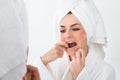 Woman flossing teeth Royalty Free Stock Photo