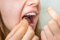 Woman flossing teeth with dental floss Royalty Free Stock Photo