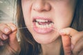 Woman flossing teeth with dental floss - retro style Royalty Free Stock Photo