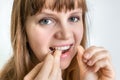 Woman flossing teeth with dental floss Royalty Free Stock Photo