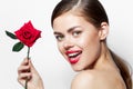 woman with flower charm Wide smile red lips bared shoulders light Royalty Free Stock Photo