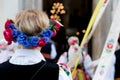 Woman with flower head wreath, dressed in polish national folk costume from Lowicz