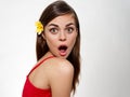 woman with a flower in her hair opened her mouth wide surprised look emotions model Royalty Free Stock Photo