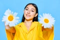 caucasian woman model blue portrait chamomile young smile happiness flower yellow