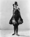 Woman in a flowered dress and ballerina shoes