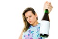 A woman in flowered dress holding bottle of red sparkling wine - blank etiquette Royalty Free Stock Photo