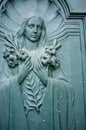 Woman with flowers on a door of the La Paz Metropolitan Cathedral - La Paz -