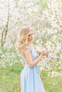 Woman in a flowery garden. Tender photo with white flowers