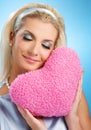 Woman with fluffy heart pillow Royalty Free Stock Photo