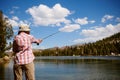 Woman fly fishing Royalty Free Stock Photo