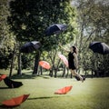Woman Flying Through The Air Holding An Umbrella Royalty Free Stock Photo