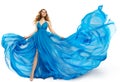 Woman Flying Blue Dress, Fashion Model Dancing in Long Waving Gown, Fluttering Fabric on White