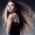 Woman with flying hair looks back Royalty Free Stock Photo