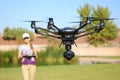 Woman Flying a High-Tech Camera Drone Royalty Free Stock Photo