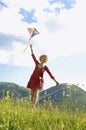 Woman Flying Kite Against Cloudy Sky