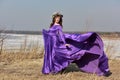 Woman flying lilac dress