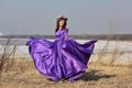 Woman flying lilac dress