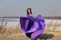 Woman flying lilac dress