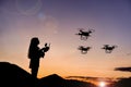 Woman flying three drones