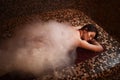 Woman in foam lying on a hot stone in hamam, sauna Royalty Free Stock Photo