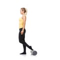 Woman, foam and roller for exercise, balance and fitness workout in studio on white background. Pilates, profile and